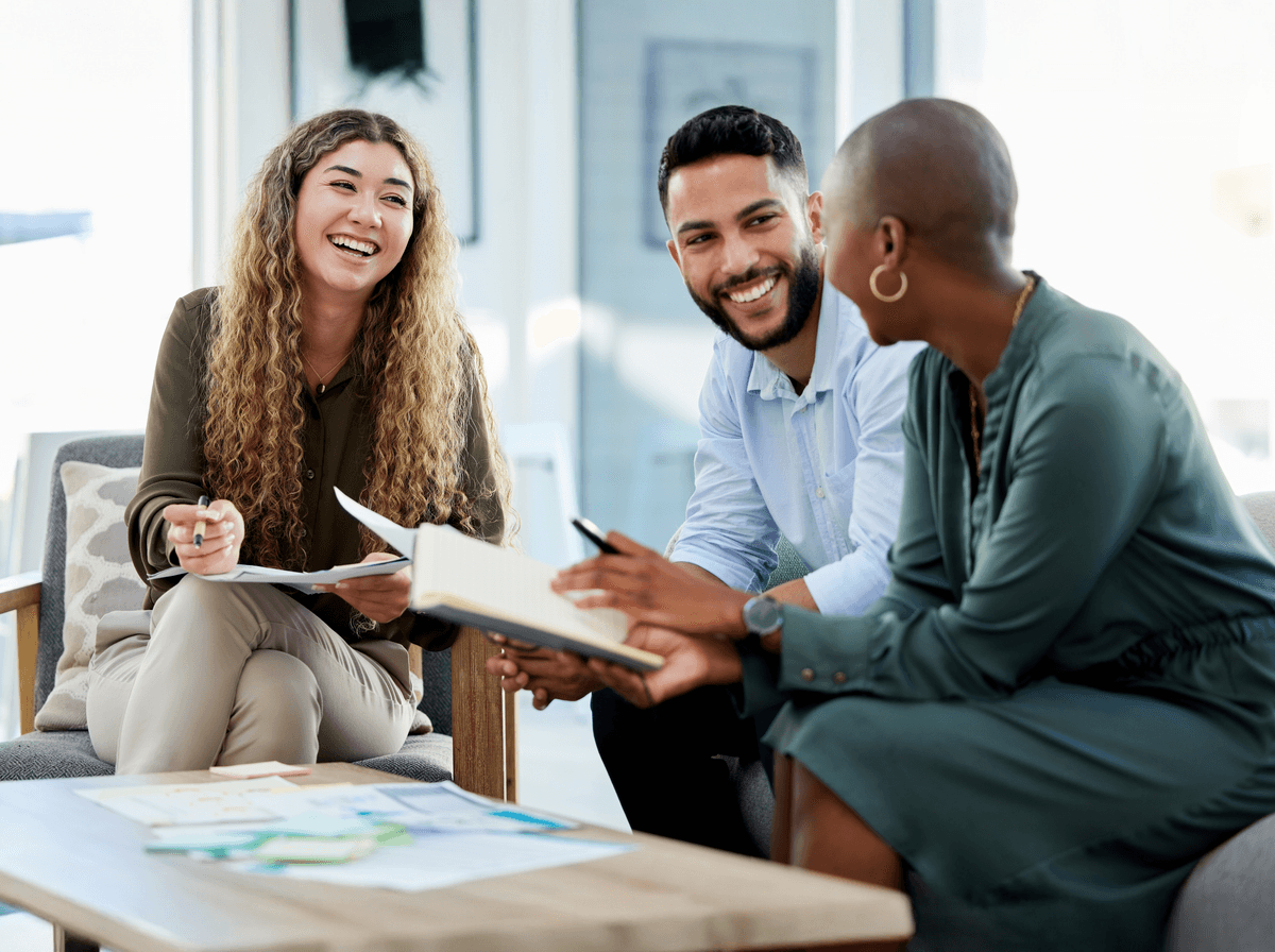 Colleagues sitting together and smiling
